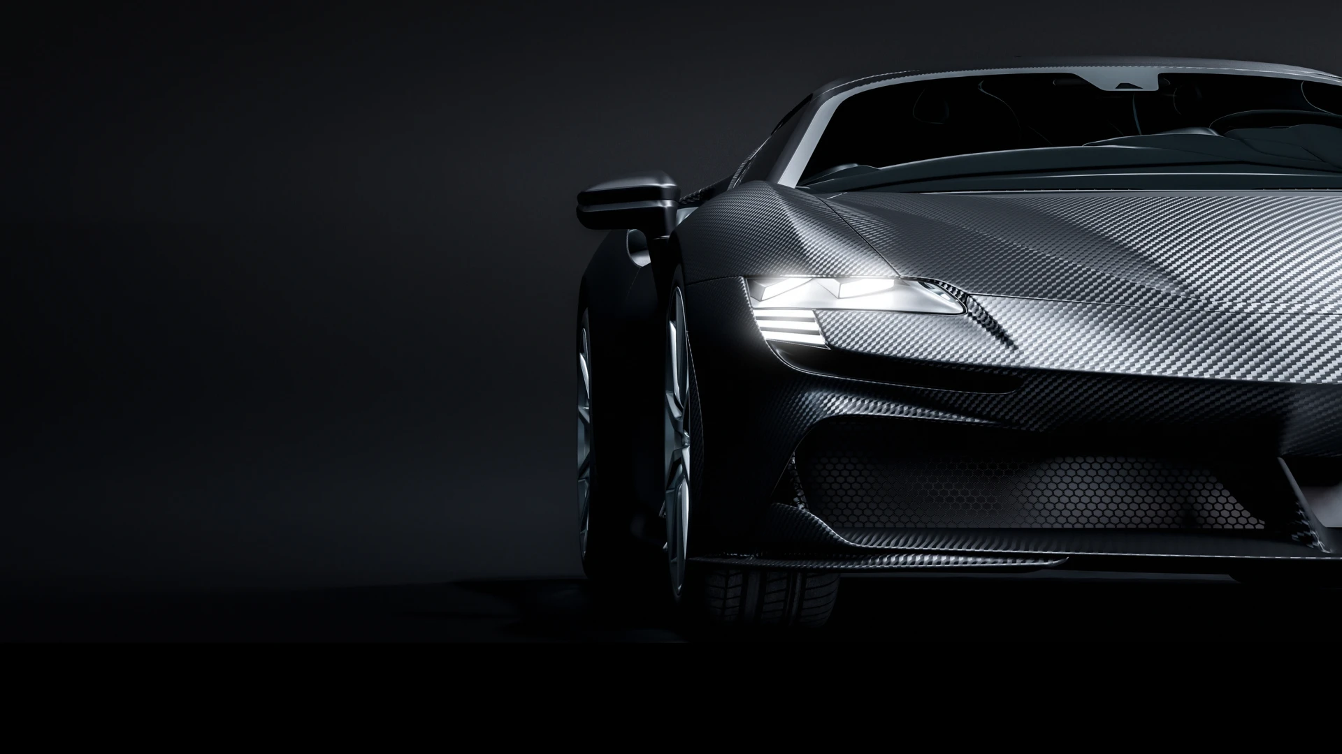 Silver carbon-fiber sports car — premium coating reference